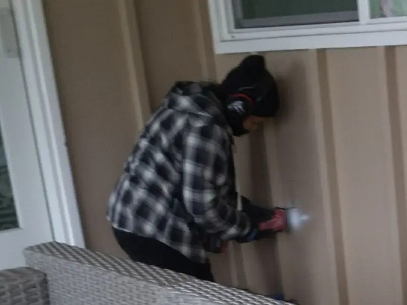 Professional electrician installing an exterior outlet in Silt